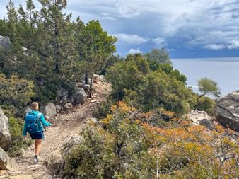 Hiker on a hiking trail in Sardinia