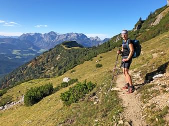 Hiker on the High Altitude Circular Path with a view of the Gosaukamm