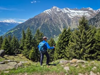 Hiker enjoys the mountain panorama near Partschins