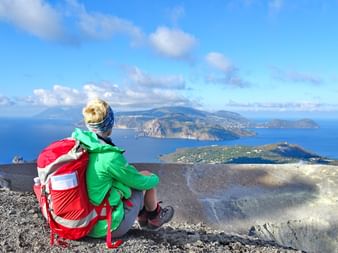 Hiking break with sea view from the edge of the crater on Vulcano
