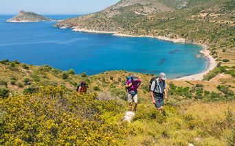 Hikers along the coast with a beautiful view of the turquoise sea