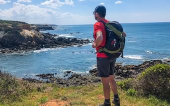 Hiker with a view of the coast
