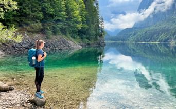 Hiker in front of the Lake Gosausee