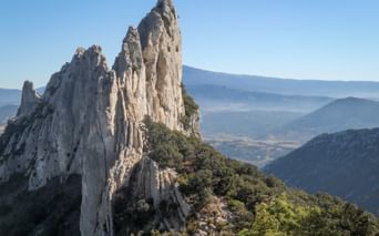 Jagged rock in the Dentelles de Montmirail with panoramic views of the valley
