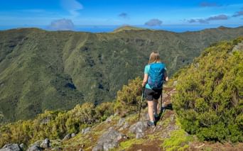 Hiker with a view of the mountain panorama
