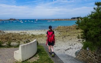 Hiker on the beach in Normandy