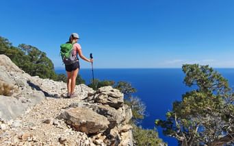 Hiker in the village of “Cala Gonone” in Sardinia