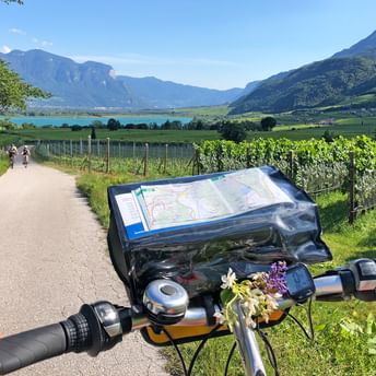 Bicycle handlebars in front of landscape in South Tyrol