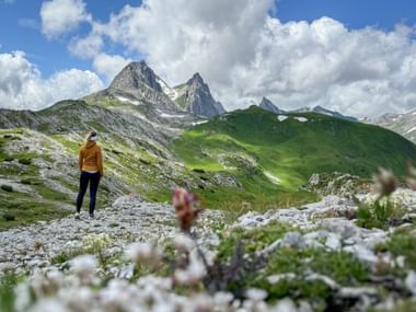 Hiker enjoys the view of the Weißschrofenspitze peak Hiker enjoys the view of the Weißschrofenspitze peak