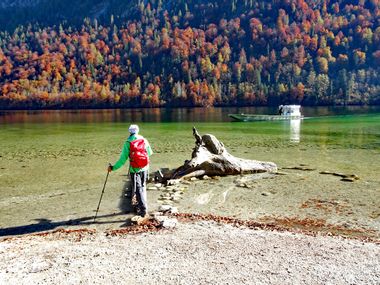 Hiker at the Königssee in autumn