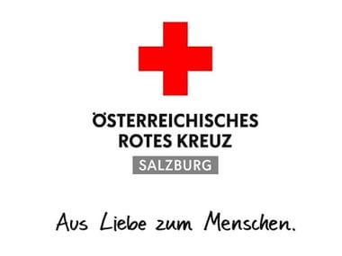 Logo des Österreichischen Roten Kreuzes Salzburg mit rotem Kreuz und Text 'Aus Liebe zum Menschen'.