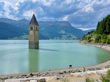 Church tower in Graun on Lake Reschen