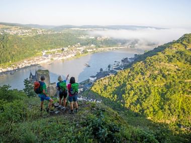 Hikers with a view of Katz Castle