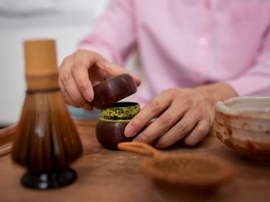 Preparation of matcha green tea, matcha broom, matcha powder, hands