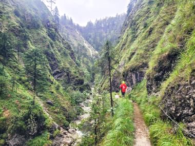 Hiking through the Burggrabenklamm gorge with a view of a waterfall
