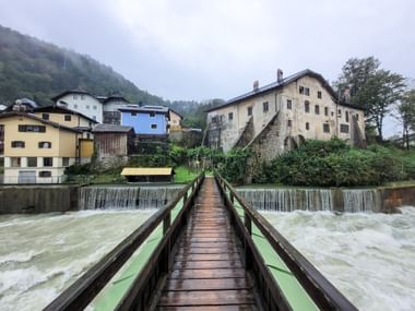 Wooden bridge over a rushing river