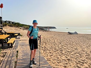Hiker on the beach of Martinhal