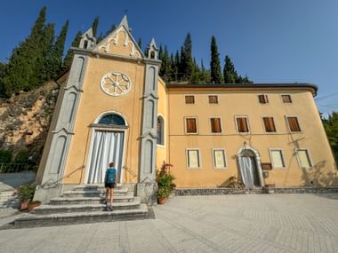 Hiker in front of a pilgrimage church