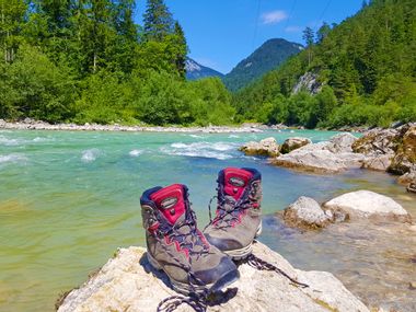 Hiking boots by the river