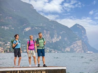 Lake Garda lakeshore with hiker