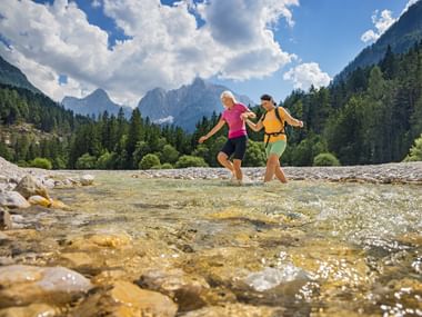 Hikers at Lake Jasna in Slovenia