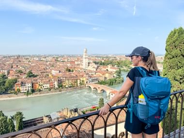 Hiker looks at the city of Verona