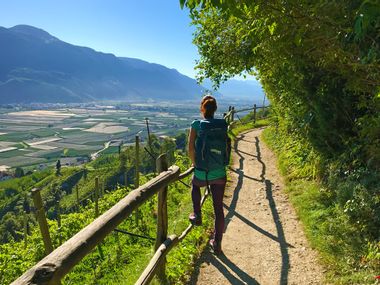 Hiker on the hiking trail in Lana