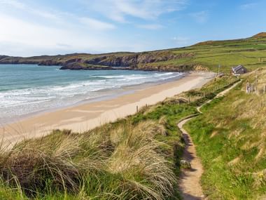 Hiking trail with a view of Whitesands Bay in Wales Hiking trail with a view of Whitesands Bay in Wales