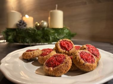 Raspberry biscuits next to the Advent wreath