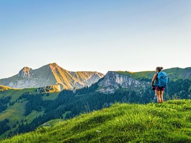 Hiker enjoys the view from Reichenau in the Kandertal Hiker enjoys the view from Reichenau in the Kandertal