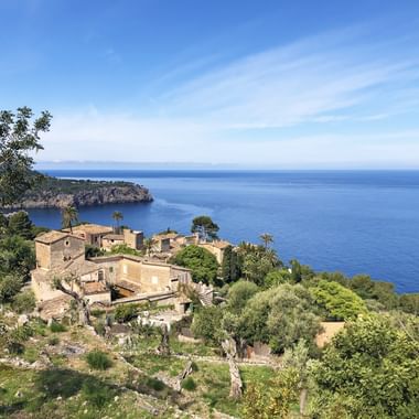 View of a typical finca in front of a bay