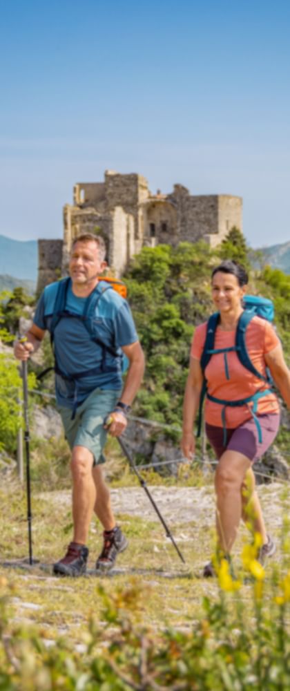 Hiking group on the way past the castle of Castelvecchio