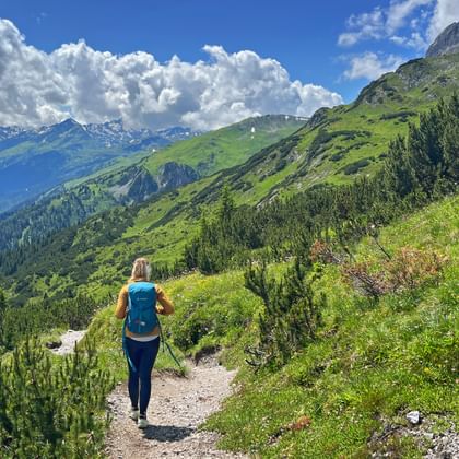 Hiker on the way from Steeg to Landeck with a marvellous mountain panorama