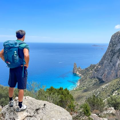 Hiker enjoys the view of the bay of Santa Maria di Navarese