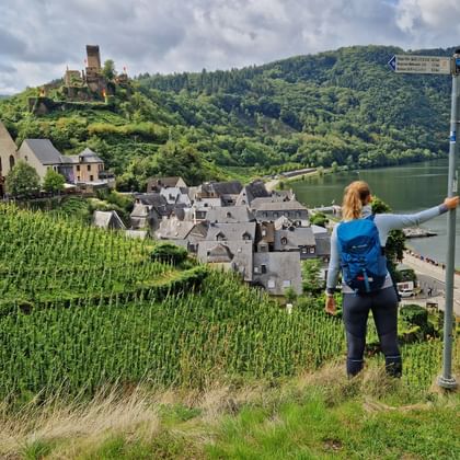 Hiker enjoys the view of Metternich Castle near Beilstein