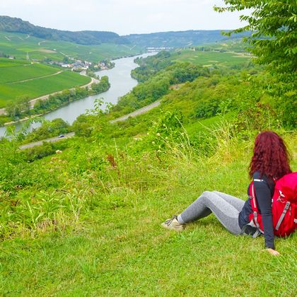 Hiker with backpack and view of the Moselle