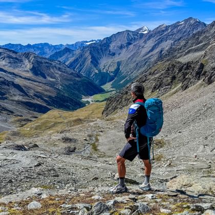 Hiker enjoys the view of the Pfossental valley