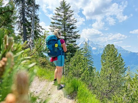 Hiker with a distant view of the Wetterstein mountains