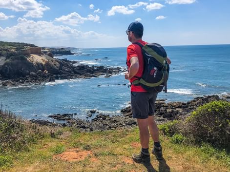 Hiker with a view of the coast