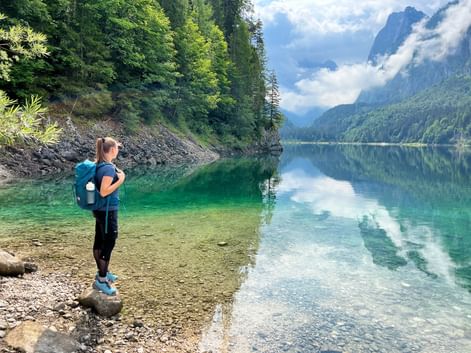 Hiker in front of the Lake Gosausee