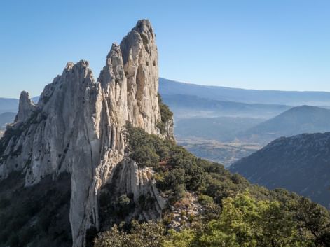 Jagged rock in the Dentelles de Montmirail with panoramic views of the valley