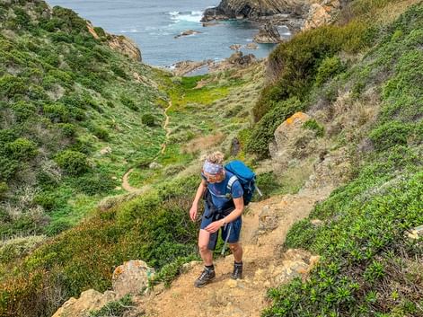 Hiker on the coastal path in Spain