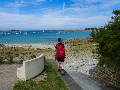 Hiker on the beach in Normandy