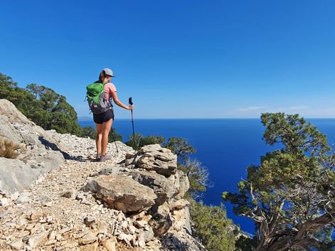 Hiker in the village of “Cala Gonone” in Sardinia