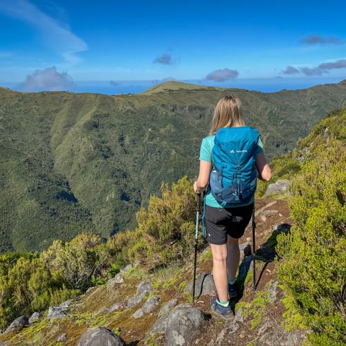 Hiker pauses on a hiking trail in Madeira
