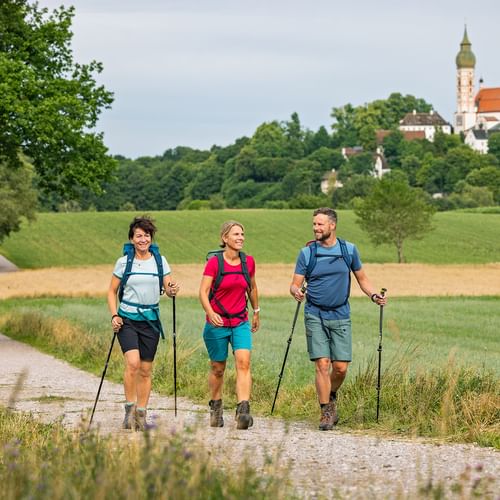 Pilgrimage hiking near Andechs Monastery Hikers on a hiking trail near Andechs Monastery