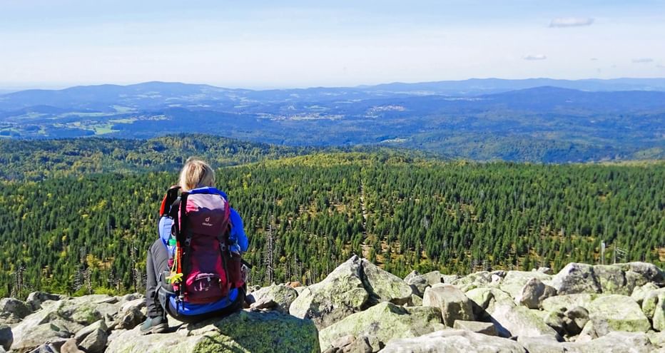Hiking break on the Lusen with a view down into the valley