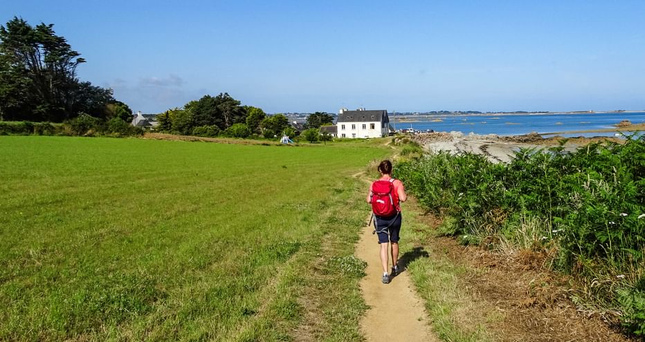 Hiker on the path along the coast