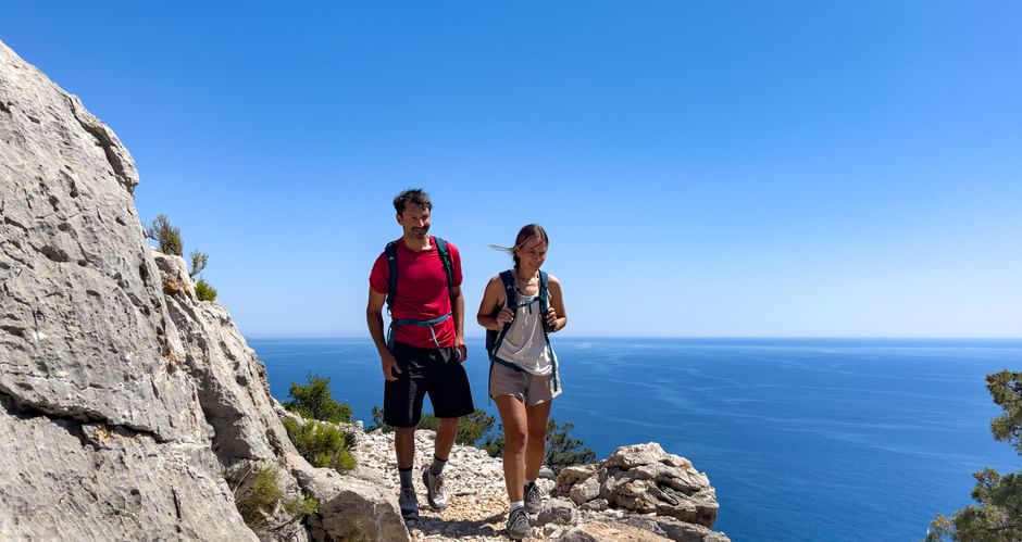 Hiking couple at Cala Mariolu