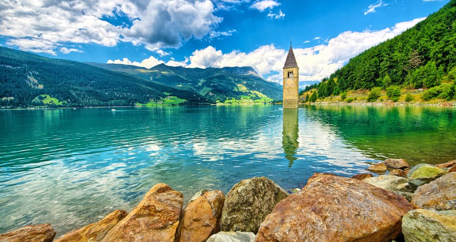 Panoramic view of Lake Kaltern with the sunken church tower